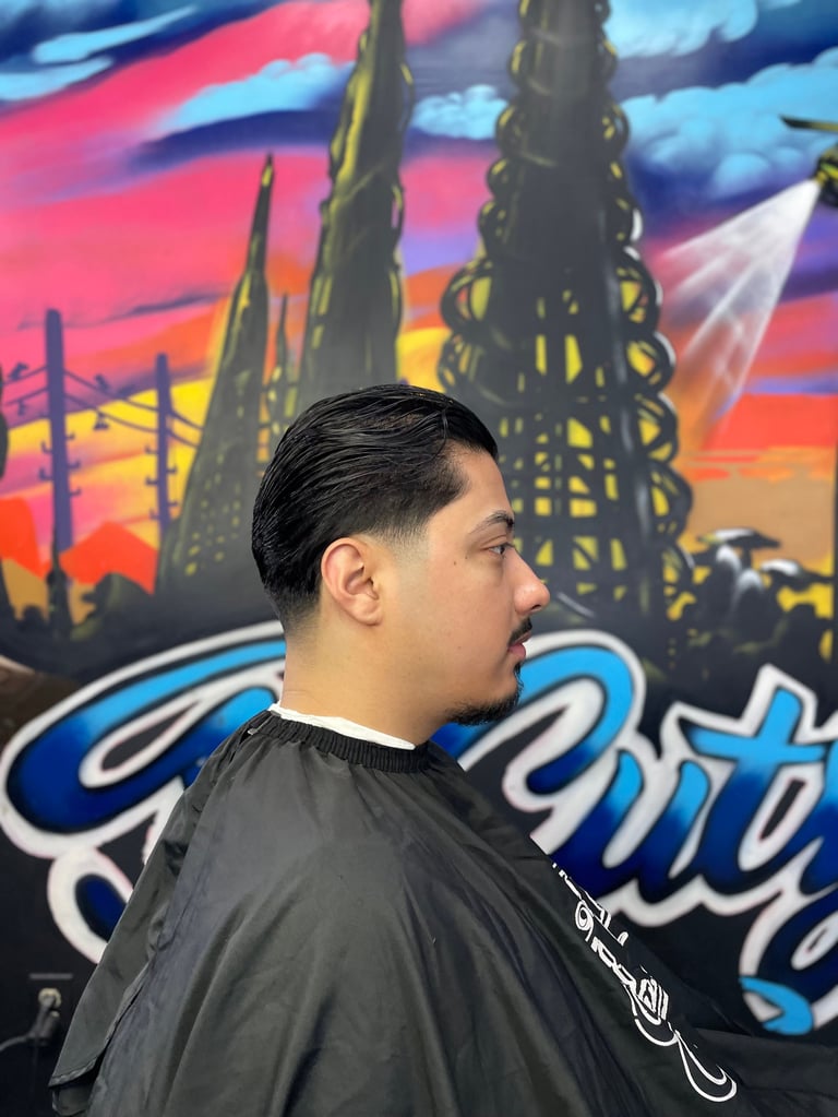 Man in profile wearing black shirt in front of colorful mural with stylized city skyline and neon text